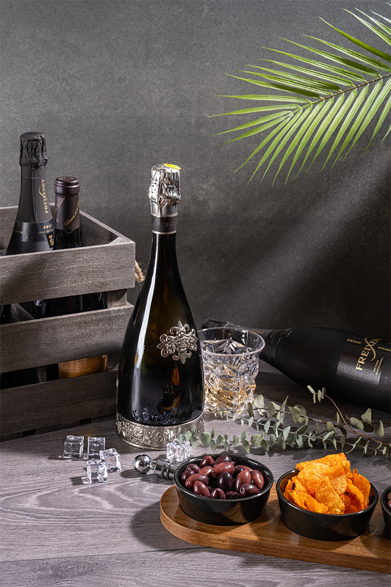 Champagne and gourmet snacks presented in a wooden gift crate